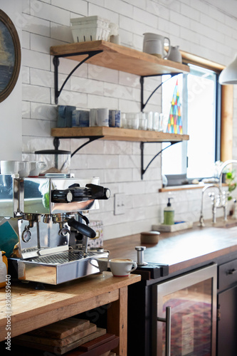 Kitchen detail with espresso machine and since in view.
