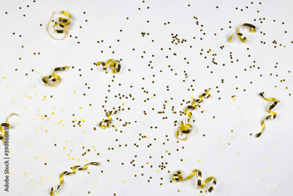 Party time background. Glitter stars and golden confetti on white background. Flat lay. - obrazy, fototapety, plakaty 