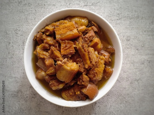 Babi kecap is an Indonesian braised pork with sweet soy sauce. It is a Chinese Indonesian classic food. Pork belly is the main ingredient in this food. Very tasty and delicious. Served on white bowl
