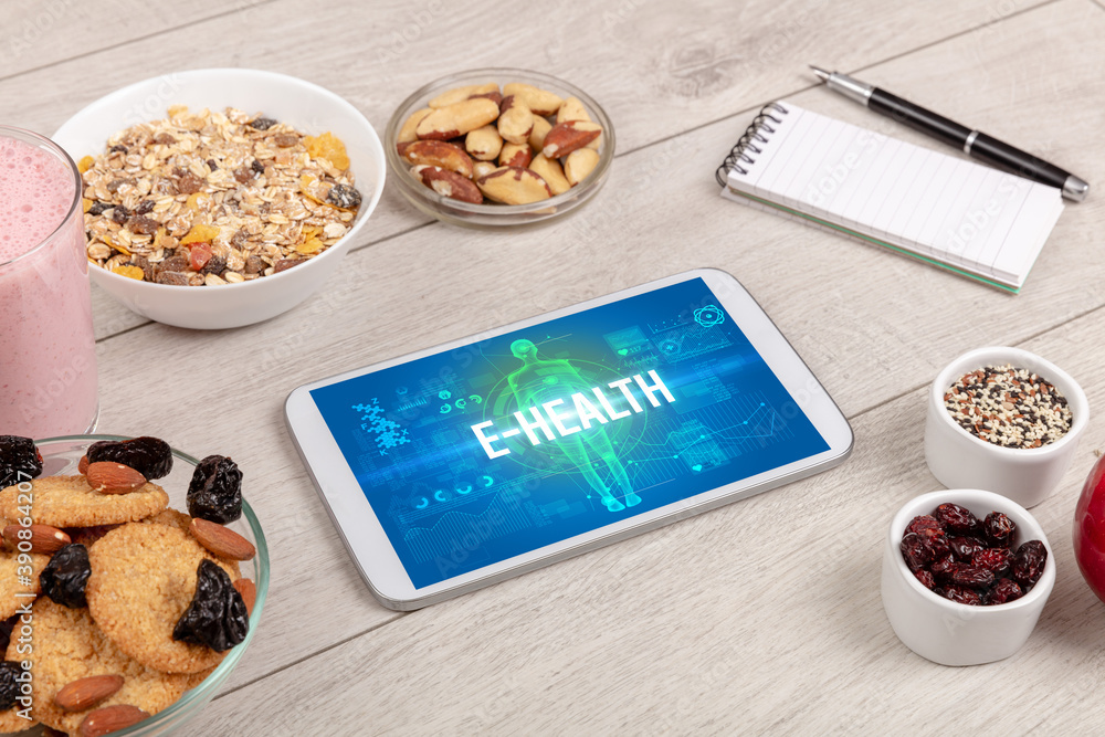 E-HEALTH concept in tablet with fruits, top view E-HEALTH concept in tablet with fruits, top view