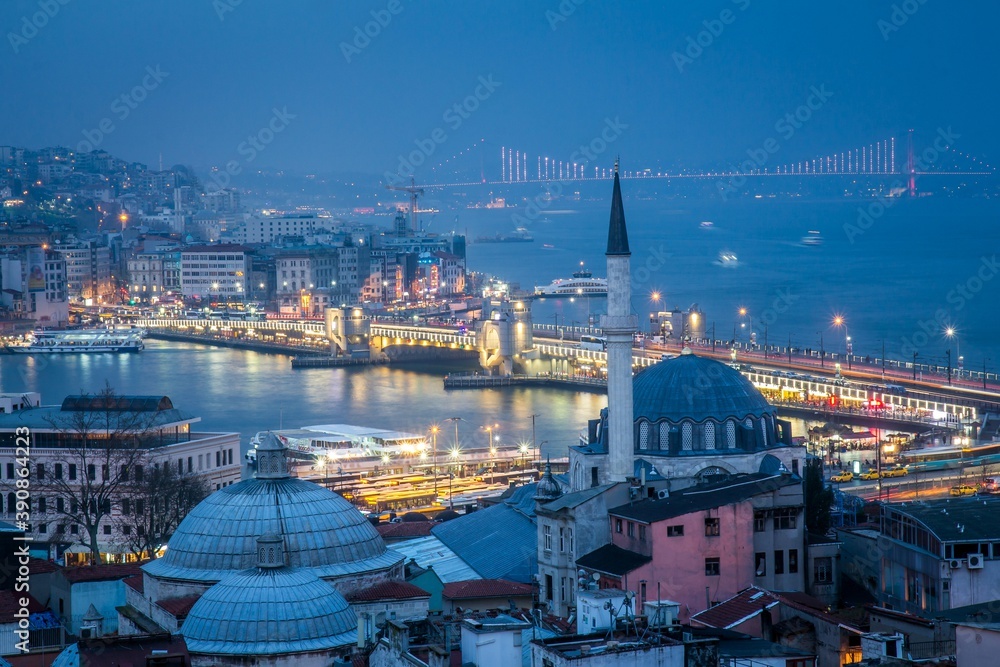Night Istambul, Turkey. Beautiful Godlen Horn, the primary inlet of the Bosphorus strait and the bridge are on the background. Night lights. Turkey.