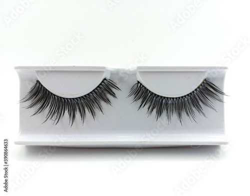 Black color eyelash extension. A beautiful make-up. Mascara for volume and length. isolated background