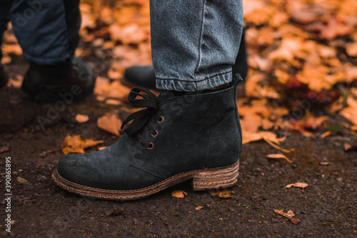 Dark suede shoes close up on woman foot. autumn shoes.