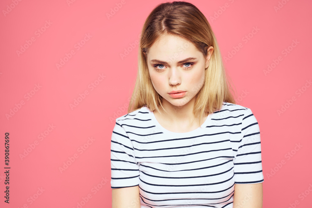 Blonde striped t-shirt emotion gesture hands displeased facial expression pink background Blonde striped t-shirt emotion gesture hands displeased facial expression pink background