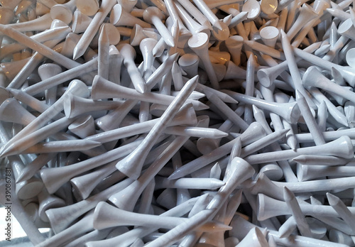 Lots of white wooden golf ball tees in store