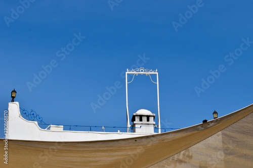 Rooftop and lanterns of a traditional white Bodrum house photo