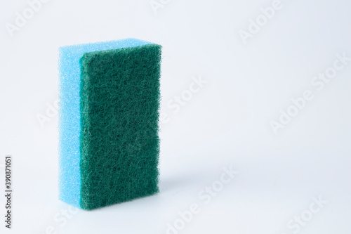 Colored sponges for washing dishes on a white background.