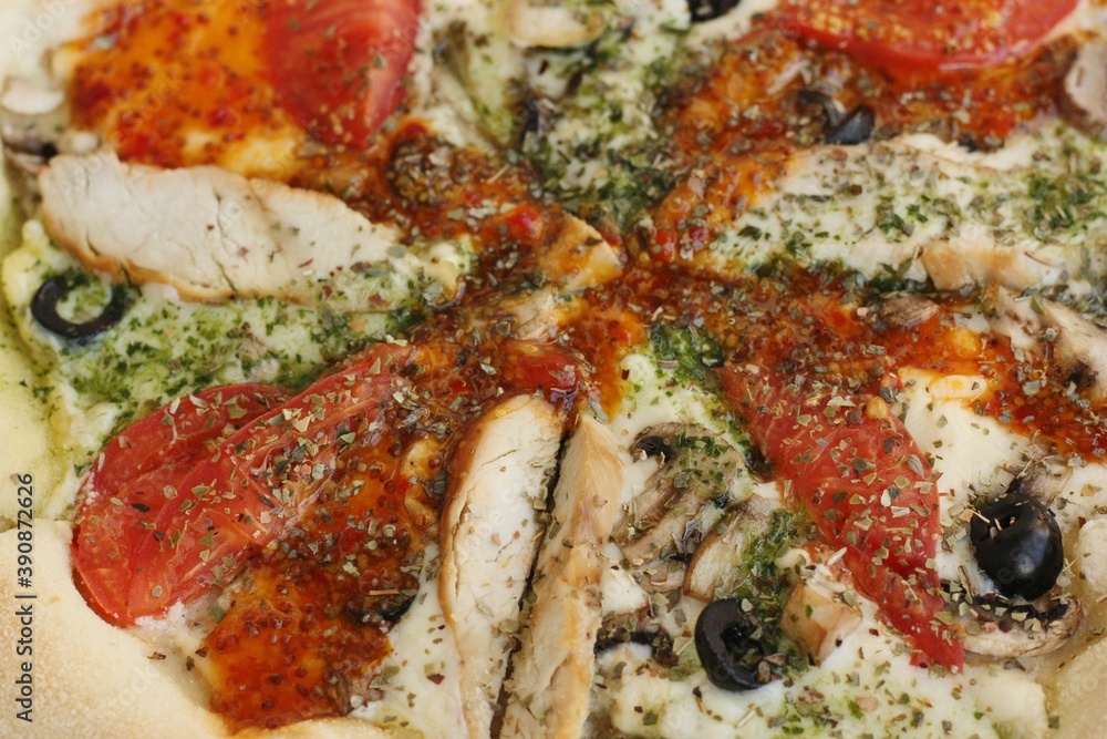 Italian pizza with chicken tomatoes and cheese Italian pizza with chicken tomatoes and cheese