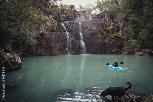 Beautiful shot of a young boy kayaking at a lake