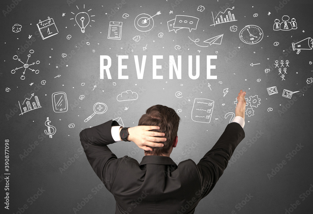 Rear view of a businessman with REVENUE inscription, modern business concept Rear view of a businessman with REVENUE inscription, modern business concept