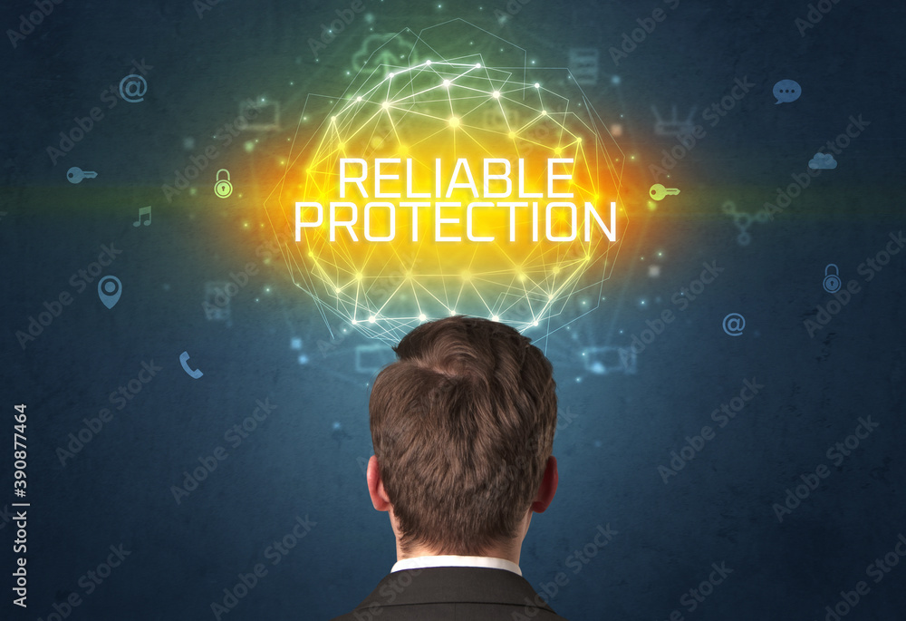 Rear view of a businessman with RELIABLE PROTECTION inscription, online security concept Rear view of a businessman with RELIABLE PROTECTION inscription, online security concept