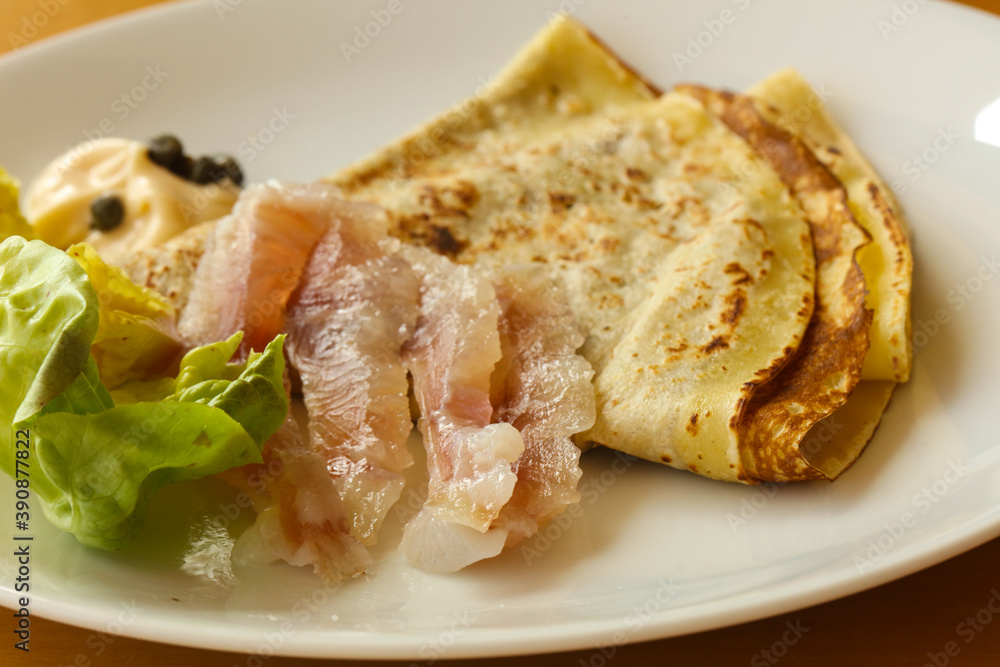 Gravlax with pancake served salad