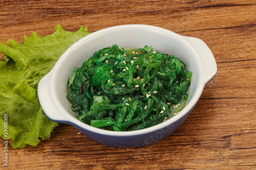 Green Chuka Seaweed Salad Isolated on White Background Top View. Wakame Sea Kelp Salat