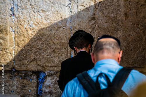 orthodox jews at the wailing wall in jerusalem