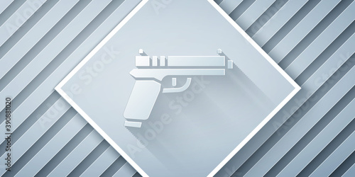 Paper cut Pistol or gun icon isolated on grey background. Police or military handgun. Small firearm. Paper art style. Vector.