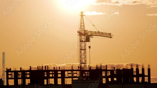 New multi-storey building and highrise cranes/Building landscape and high crane. photo