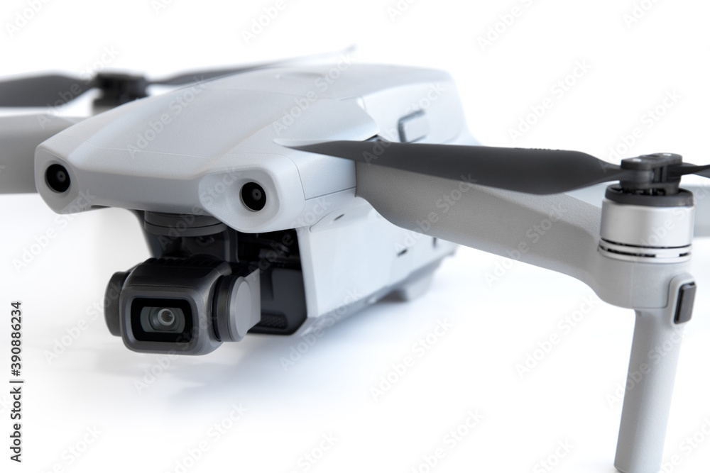 Close-up of a drone camera on a white background. Close-up of a drone camera on a white background.