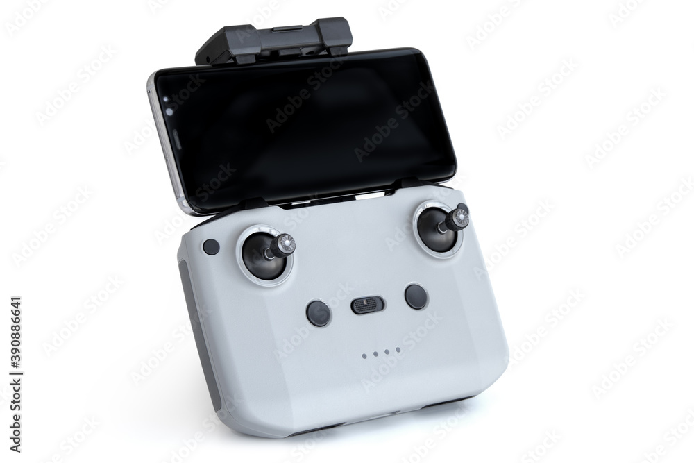 Quadcopter remote control with phone on white background Quadcopter remote control with phone on white background
