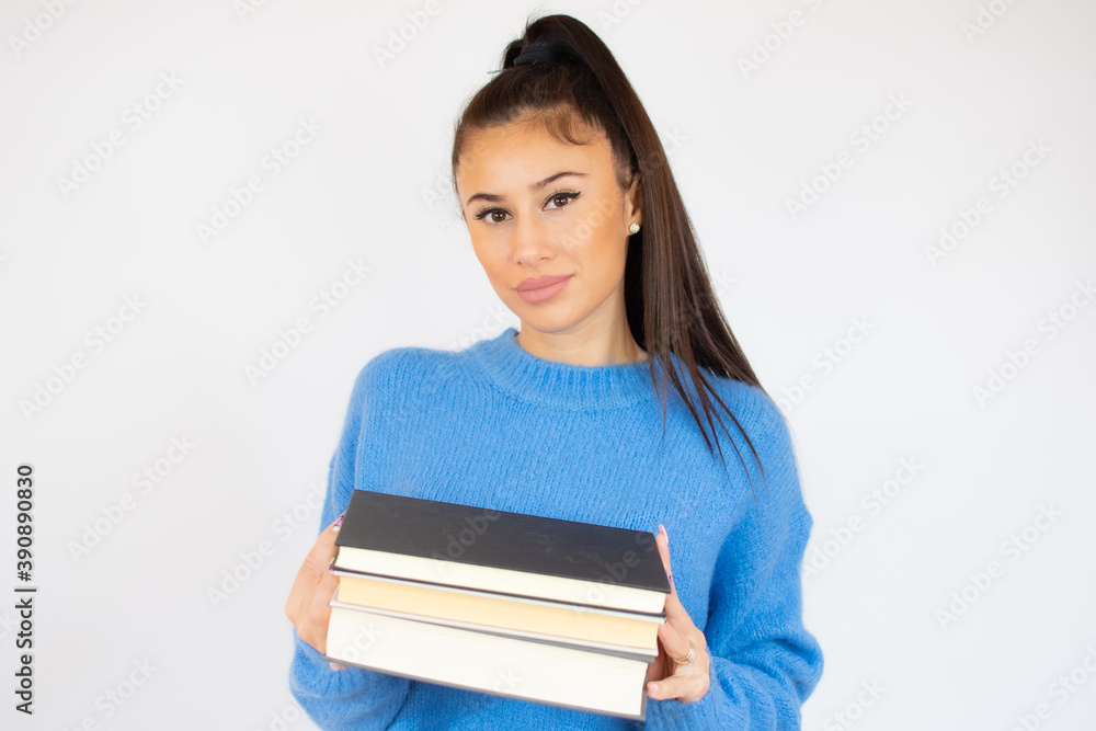 Isolated young happy beautiful woman holding books Isolated young happy beautiful woman holding books