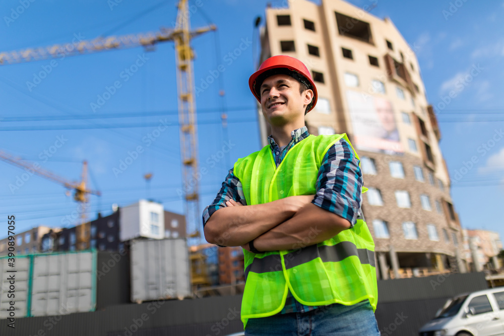 custom made wallpaper toronto digitalYoung engineers man crossed hands at the construction. Young man holding a blueprint and looking at it with inspiration.