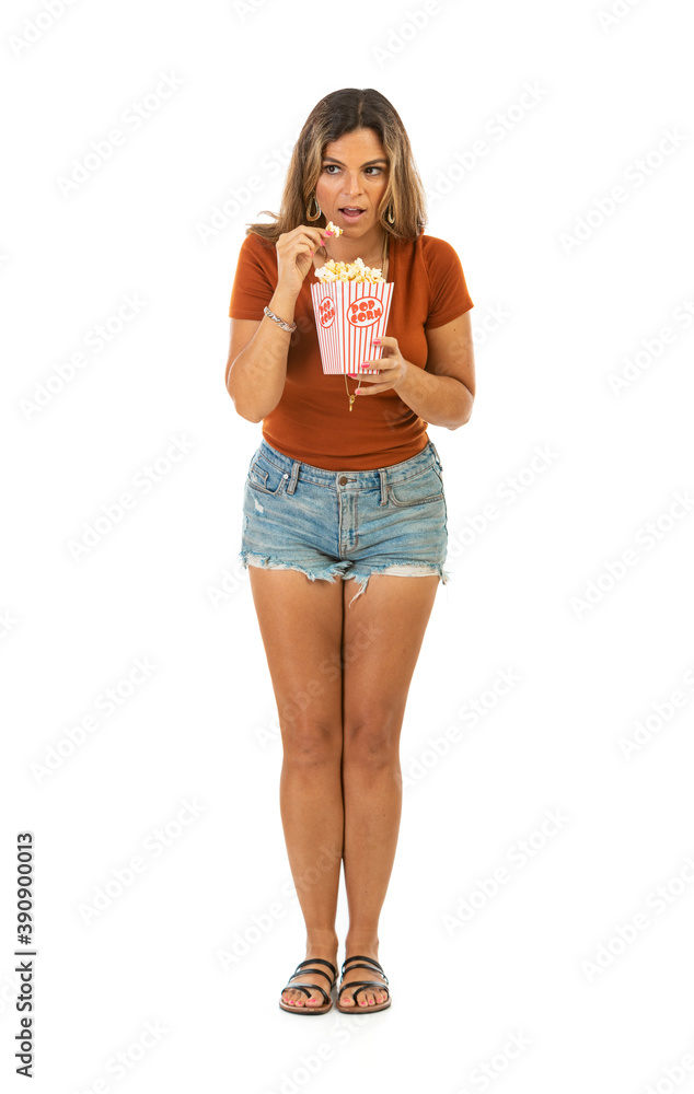 Casual Woman Eating Popcorn With Surprised Look Casual Woman Eating Popcorn With Surprised Look
