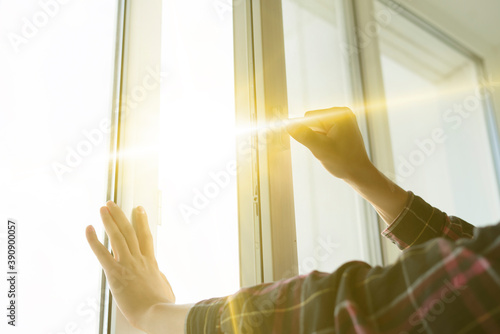 hand open window to get some fresh air inside the room