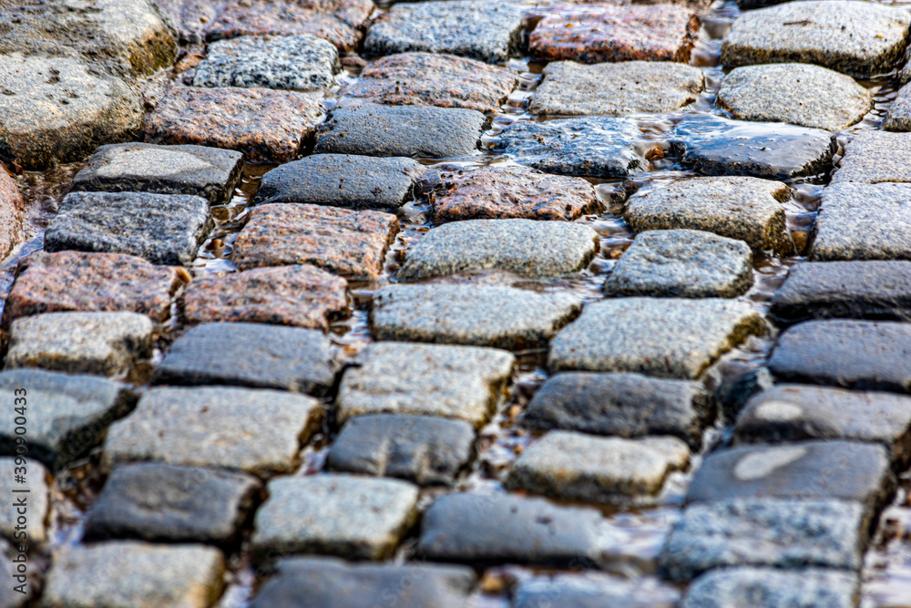 Springtime. Stone pavement covered with water Springtime. Stone pavement covered with water