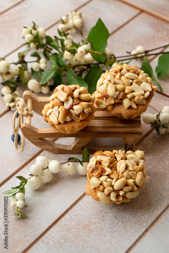 Muffins with peanut on white shabby background