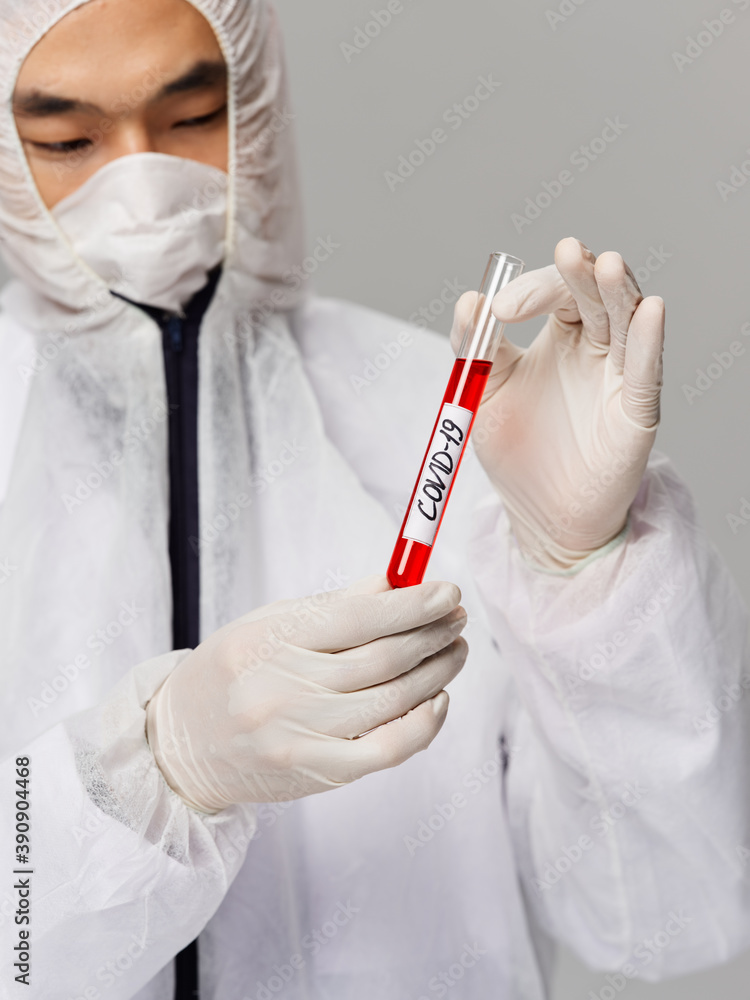Asian male laboratory analyzes diagnostics typing covid-19 treatment Asian male laboratory analyzes diagnostics typing covid-19 treatment