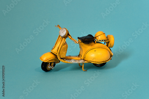 Old toy motorbike on different backgrounds