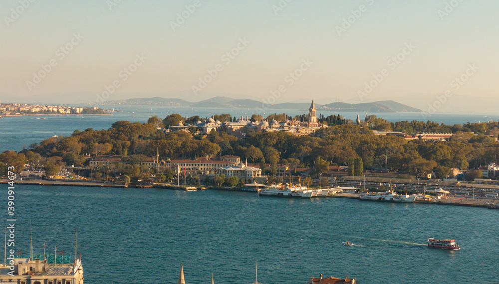 Topkapi Palace near Eminonu in Istanbul. The prince islands are visible in the backside of Topkapi Palace. Ferries are passing. Istanbul Golden Horn View with Topkapi Palace.