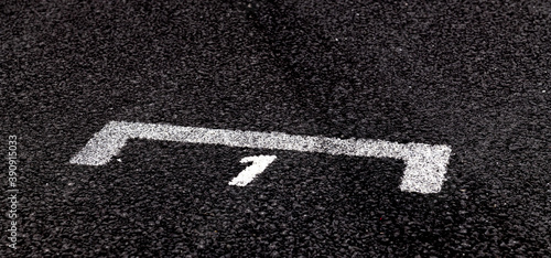 Number one position in competition sign on asphalt track close up