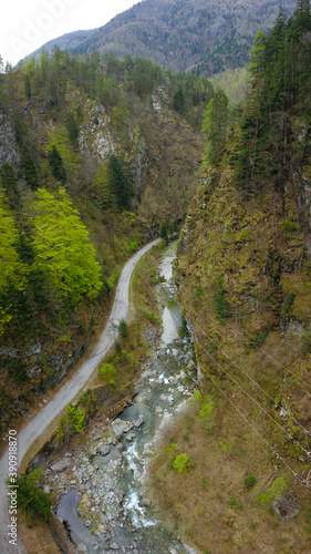 Aerial drone view over the Latorita river that flows along its beautiful Gorges. Capatanii Massif, Spring time, Carpathia, Romania.