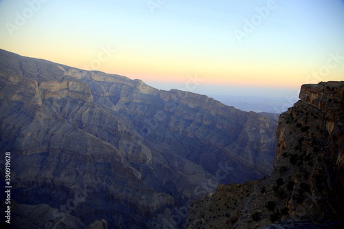 Panorama with contrasting colors of the mountains at sunset, Wadi Ghul the Oman's Grand Canyon, Jabal Akhdar, Sama Heights, Oman