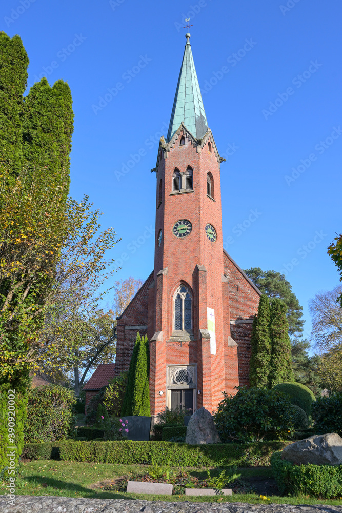 Front view of the St.-Clemens St.-Katharinen church, medieval red brick architecture in Seedorf Schaalsee, tourist destination in the nature reserve, Schleswig-Holstein, Germany, blue sky, copy space