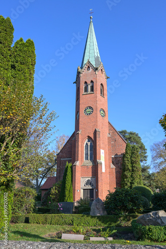 Front view of the St.-Clemens St.-Katharinen church, medieval red brick architecture in Seedorf Schaalsee, tourist destination in the nature reserve, Schleswig-Holstein, Germany, blue sky, copy space