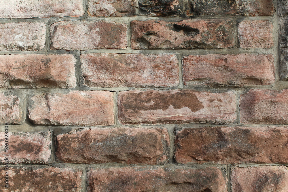 Fototapeta premium Rote Natursteinmauer