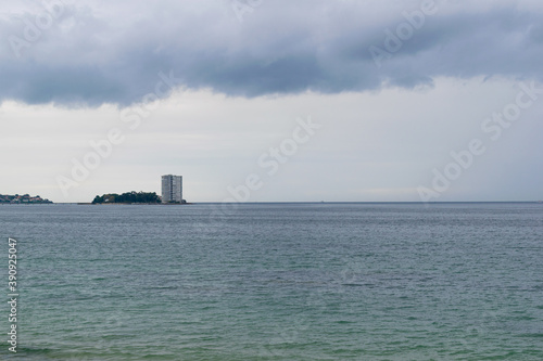 View of the island of Toralla during the day with a stormy sky. Vigo photo