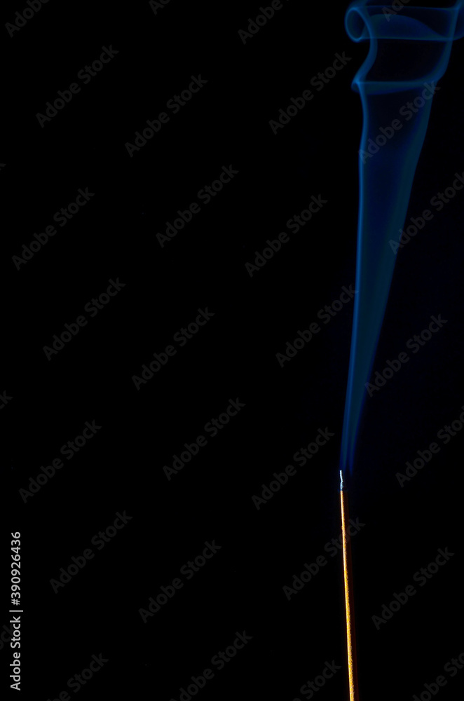 incense and smoke close-up on a black background incense and smoke close-up on a black background