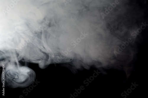 puffs of smoke thick on a black background close-up