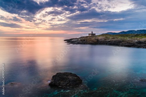Dawn at the beautiful Mediterranean Sea (S`Arenella Lighthouse, Catalonia, Alt Emporda, Spain) photo