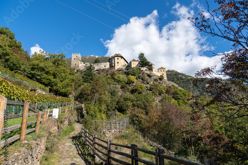 Vertical shot of Juval Castle under blue sky in Italy photo