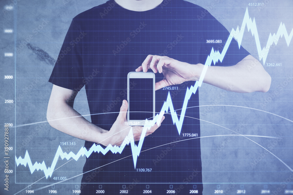 Double exposure of man's hands holding and using a digital device and forex graph drawing. Financial market concept. Double exposure of man's hands holding and using a digital device and forex graph drawing. Financial market concept.