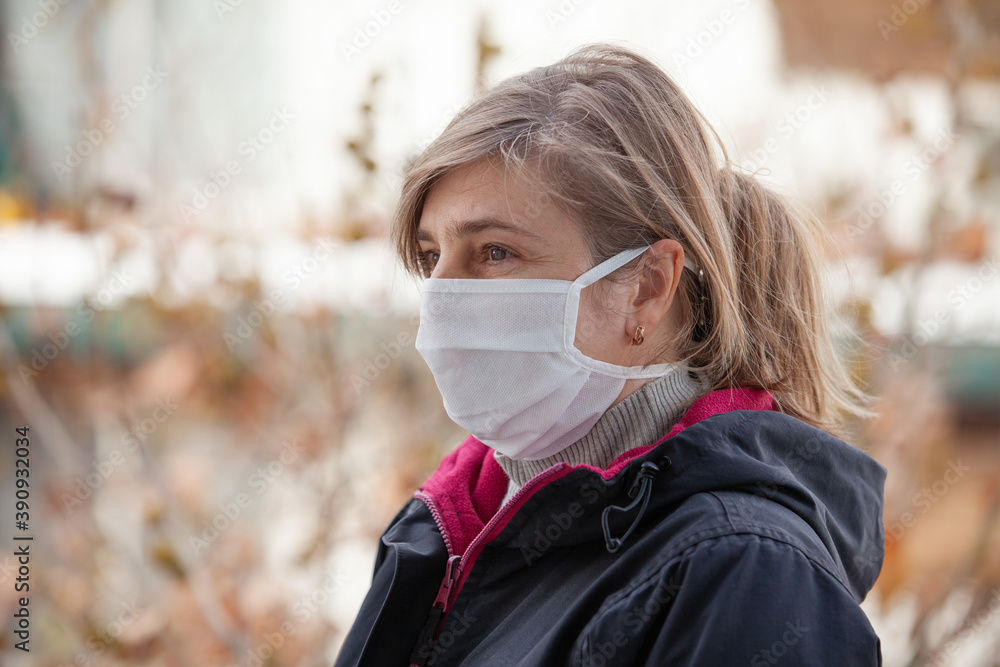 portrait of woman in medical mask outdoors portrait of woman in medical mask outdoors