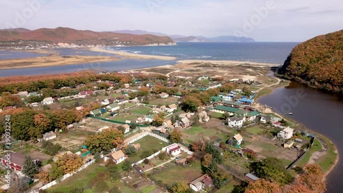 Aerial view: The camera flies over the sea village of Smychka in the Primorsky Territory.  photo