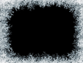 Frostwork. Decorative ice crystals frame on black matte background