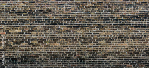 Old Chicago black, grey, brown, dark red bricks wall background 