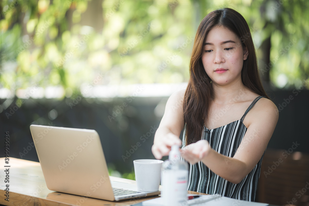 Hands sanitizer washing for business people that working on laptop at home during quarantine from coronavirus covid-19, work from home Hands sanitizer washing for business people that working on laptop at home during quarantine from coronavirus covid-19, work from home