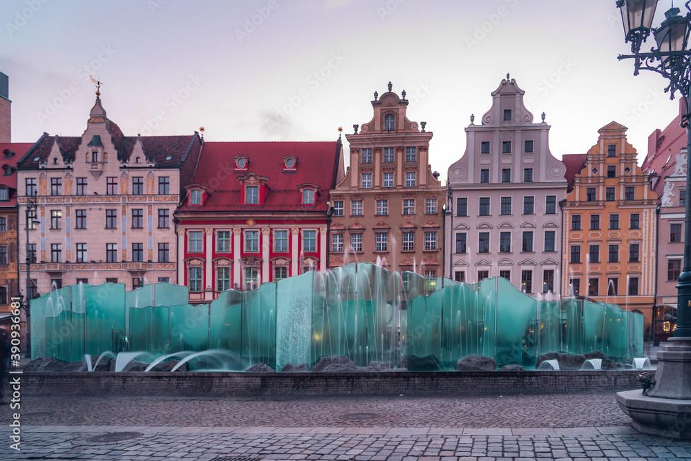 Obraz premium Wrocław is a city on the Oder River in western Poland. It’s known for its Market Square, elegant townhouses and featuring a modern fountain.