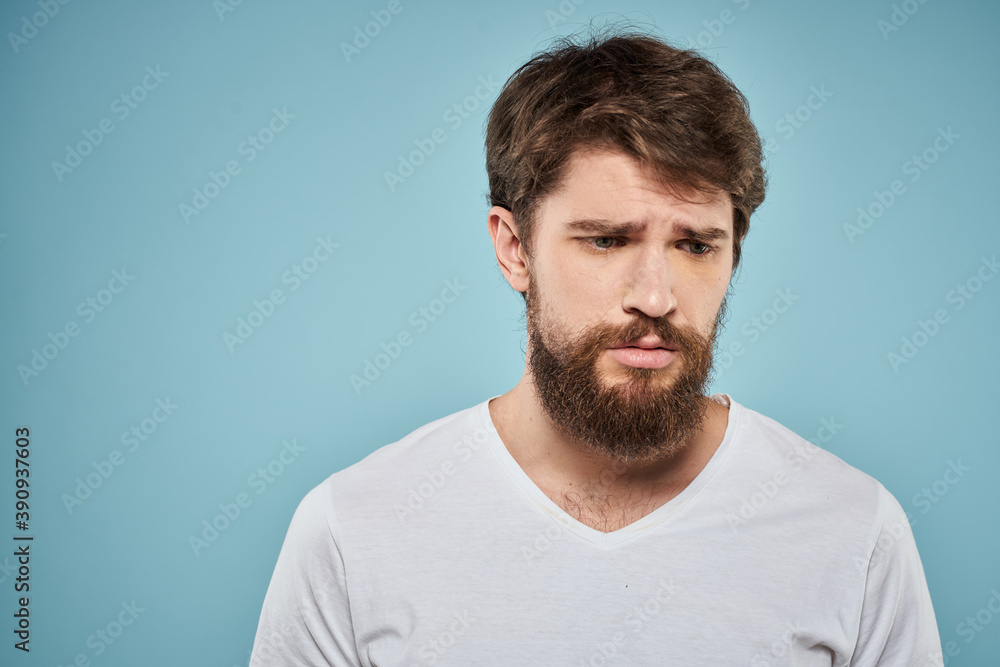 Fototapeta premium Bearded man emotions white t-shirt lifestyle gestures with hands blue backgrounds